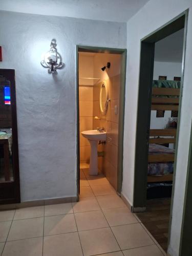 a bathroom with a sink and a mirror at Casa Calo Bialet Massé in Bialet Massé