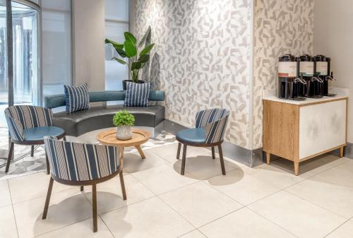 a waiting room with chairs and a table and a counter at Fairfield Inn by Marriott New York Manhattan/Financial District in New York