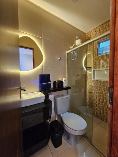 a bathroom with a toilet and a sink and a shower at Fully equipped apartment - Jardim Boa Vista in Caruaru