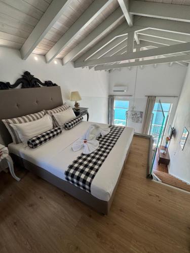 a bedroom with a large bed in a room at Porto Enetiko Suites in Rethymno