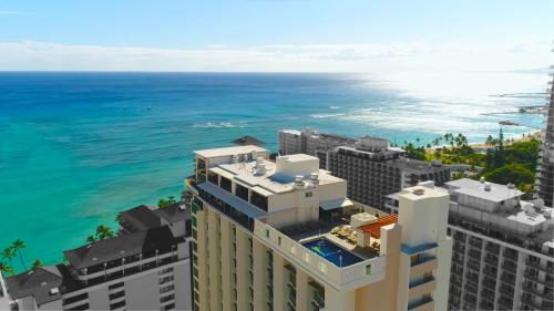an aerial view of a building with the ocean in the background at The Imperial Hawaii Resort in Honolulu