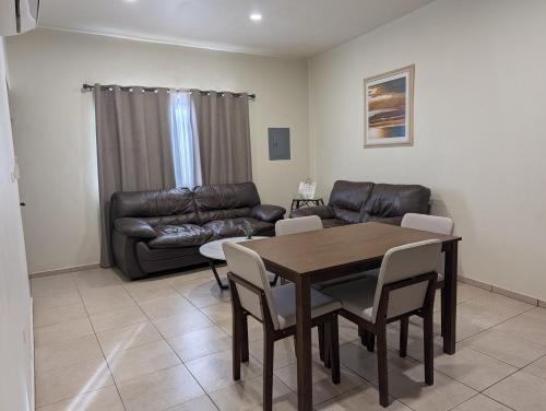 a living room with a table and a couch at Departamento Y in Loreto