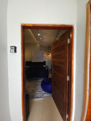 a door into a bedroom with a bed at Fully equipped apartment - Jardim Boa Vista in Caruaru