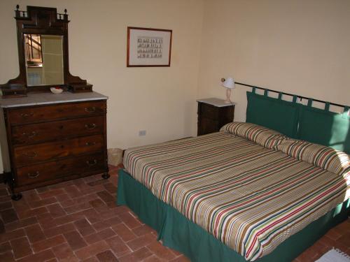 Postel nebo postele na pokoji v ubytování Fattoria di Migliarino