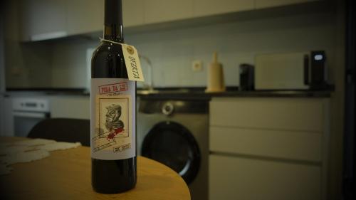 a bottle of wine sitting on top of a table at Casa da Corredoura in Santa Marta de Penaguião