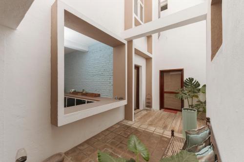 a house with a large window on the side of it at Villa Monsoon in Mount Lavinia