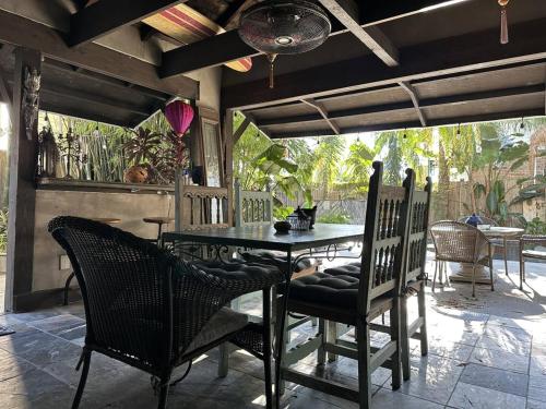 a patio with a table and chairs on a patio at Historic- Salt Pool-Balconies-Near French Quarter in New Orleans