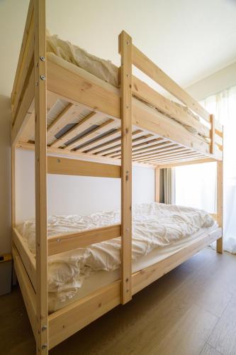 a couple of bunk beds in a room at Chill Place 120 Ayase in Tokyo