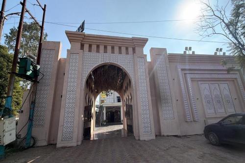 an entrance to a building with an archway at Hotel Beubelle in Meerut