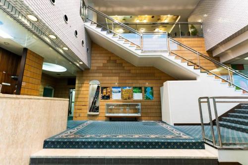 a lobby with stairs in a building at Hotel K Yuzawa 越後湯澤溫泉旅館 in Yuzawa
