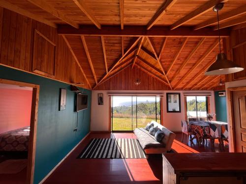 a living room with a couch and a table at Cabaña arriendo Salome in Valdivia