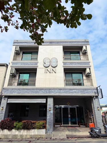 a building with two rings on the front of it at 98Inn in Xiaoliuqiu