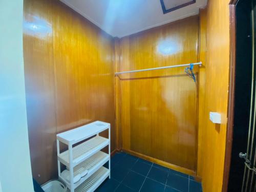 a bathroom with a shower and a white shelf at Paradise view A5 -Kantiang paradise resort- in Ko Bu Bu