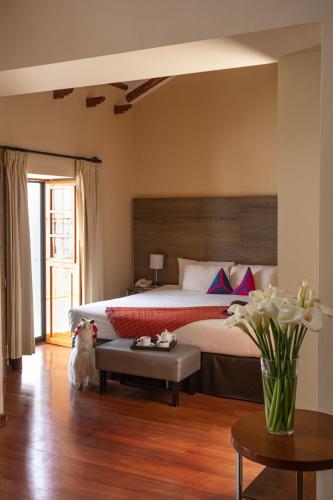 En eller flere senge i et værelse på Union Hotel Cusco