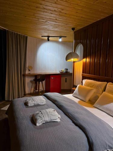 a bedroom with a bed with a towel on it at Dream River Sapanca in Sapanca