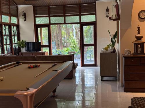 a living room with a pool table in it at Dark Green Resort - Airport Transit Villa in Negombo