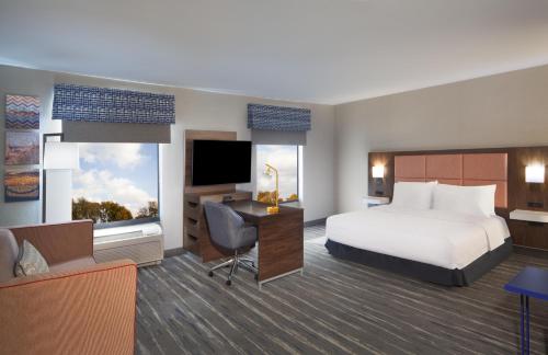 a hotel room with a bed and a desk at Hampton Inn & Suites Cleveland-Mentor in Mentor