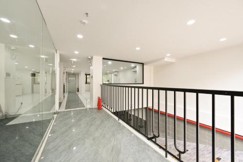 an empty hallway of a building with a red fire hydrant at Soi by La Doma Express in Ho Chi Minh City