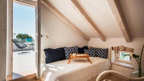 a room with a bed with a table on it at Villa Mendula -Orebic by Villas Guide in Orebić