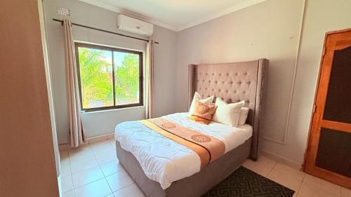 Llit o llits en una habitació de Villa Cassandra