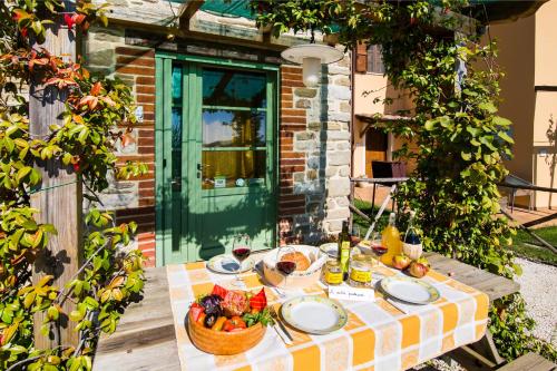 a table with a basket of fruit on it at Agriturismo La Coccinella in Valfabbrica
