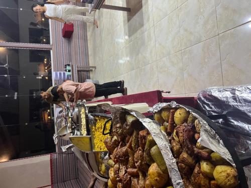 a table with a bunch of food on display at Wadi Rum Main Road Visitor Center in Disah