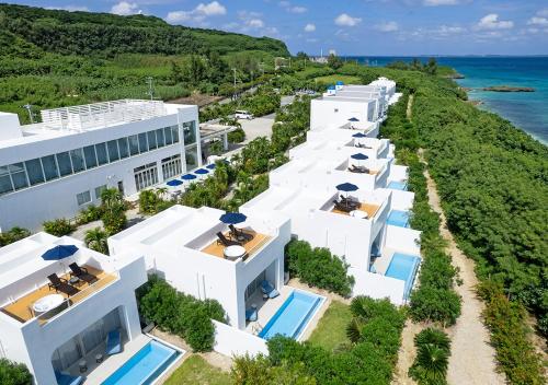 an aerial view of a row of white buildings at Blue Ocean Hotel&Resort MIYAKOJIMA in Miyako-jima
