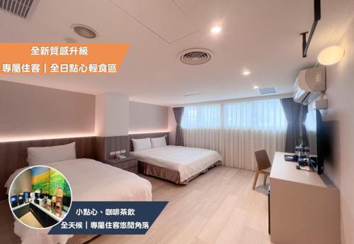 a hotel room with two beds and a desk at Nagahiro Hotel, Taichung Wenxin Branch in Taichung
