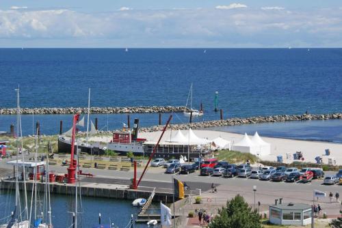 a marina with a boat in a parking lot at Blockhaus mit grosser überdachter Terrasse in Damp
