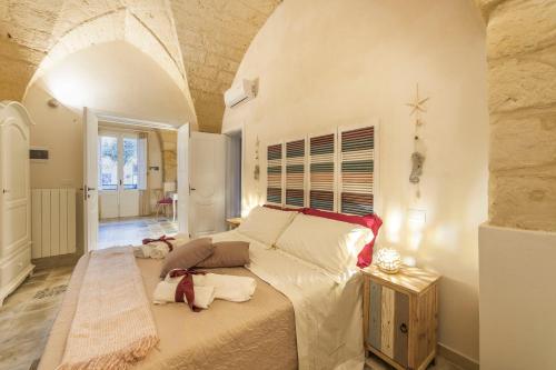 a bedroom with a large bed in a room at La Luna In Cortile in Lecce