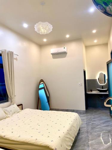 a hospital room with a bed and a television at Gạo homestay Dốc lết in My Luong