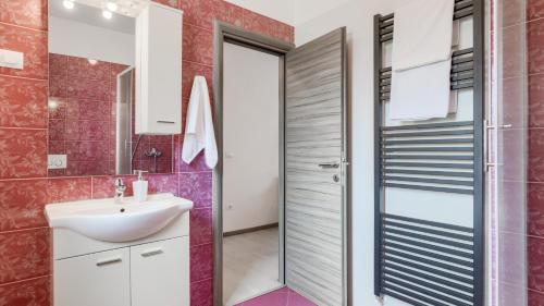 a bathroom with a sink and a mirror at Villa Melnica by Villas Guide in Barban