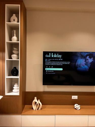 a flat screen tv sitting on a wall at Luxurios seaside apartment 2 in Durrës