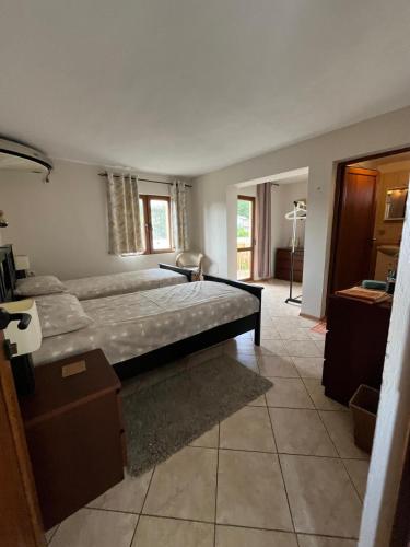 a bedroom with a large bed in a room at Villa Tunley in Razvalini Balchikioy