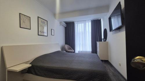 Llit o llits en una habitació de Russo Apartament