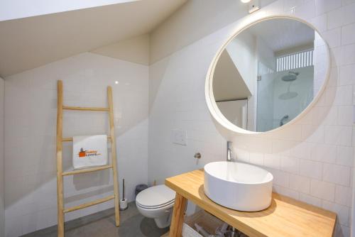 a bathroom with a sink and a mirror at Charming design house in Montijo with garden - 43 in Montijo