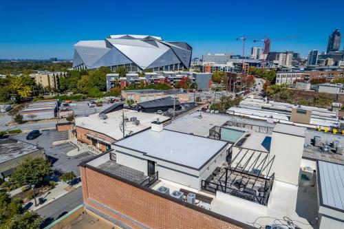an aerial view of a city with a large building at Top Floor Penthouse Lofts in Atlanta