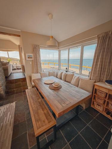 a living room with a couch and a table at Smiley's Cottage in Doagh