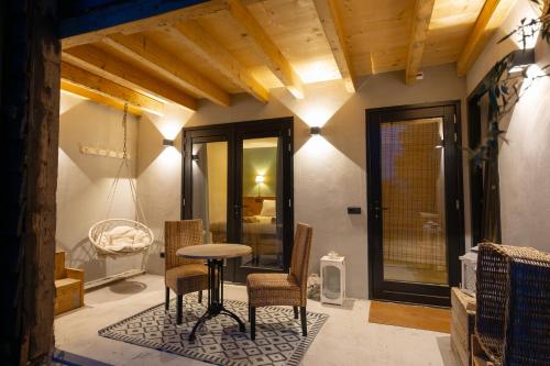 a dining room with a table and chairs in a room at Bed & Breakfast De Tol in Sint Annaland