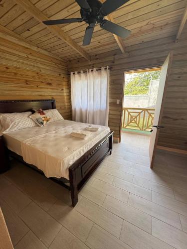 a bedroom with a bed and a ceiling fan at Las Indgenas 6BR Pool Jacuzzi Gazebo in Imbert