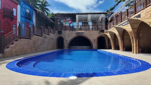 a swimming pool in the middle of a building at Alcasas Resort in Duero
