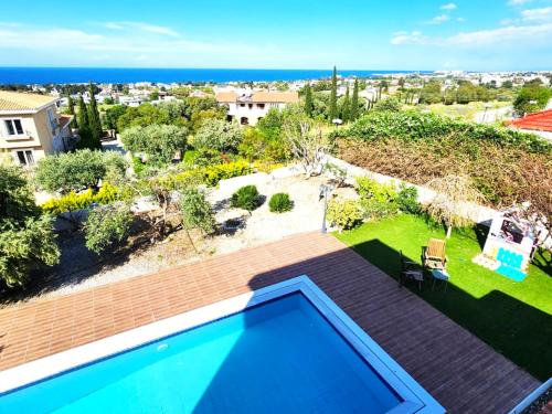 a view of a backyard with a swimming pool at Villa Amazing by HolidayKeys in Kyrenia