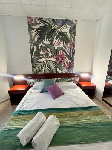 a bedroom with a bed with two pillows on it at Hotel Elite in Turin
