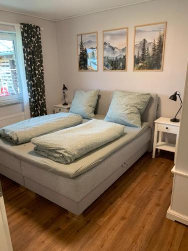 a bedroom with a bed with two pillows on it at Ferienwohnung Unterm Nastberg in Andernach