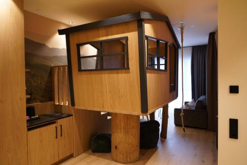 a room with a tree house on a pole at Das Waldhotel - Spa & Wellness Resort in Todtnau