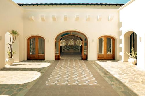 an internal view of a building with a hallway at Zeus Eretria Resort in Eretria