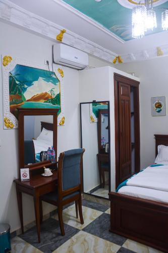 Llit o llits en una habitació de lynna hôtel