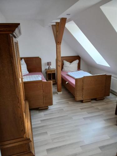two beds in a room with a attic at Haus Carl-Hubert -Schwerin Görries - in Klein Rogahn