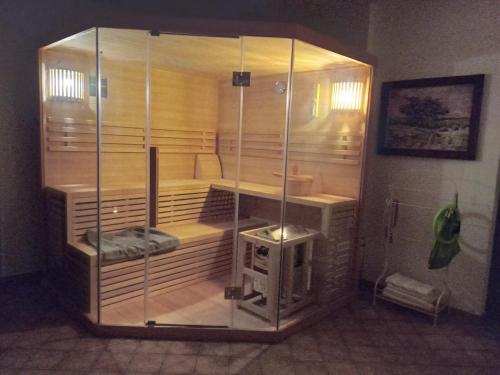 a large glass enclosure in a room at Aparthotel Schafshorn in Schaprode