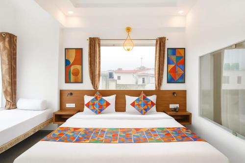 a bedroom with a bed and a window at MADHUBAN STAYS rishikesh in Rishīkesh